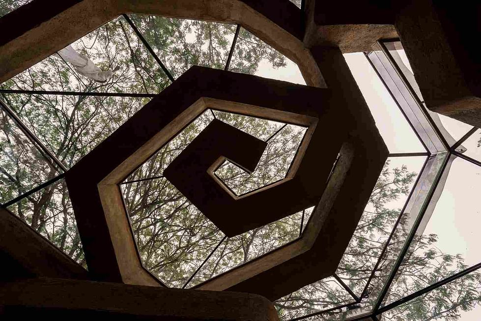 The spiral ceiling at Chuzhi is made with plastic bottle beams stacked with earth