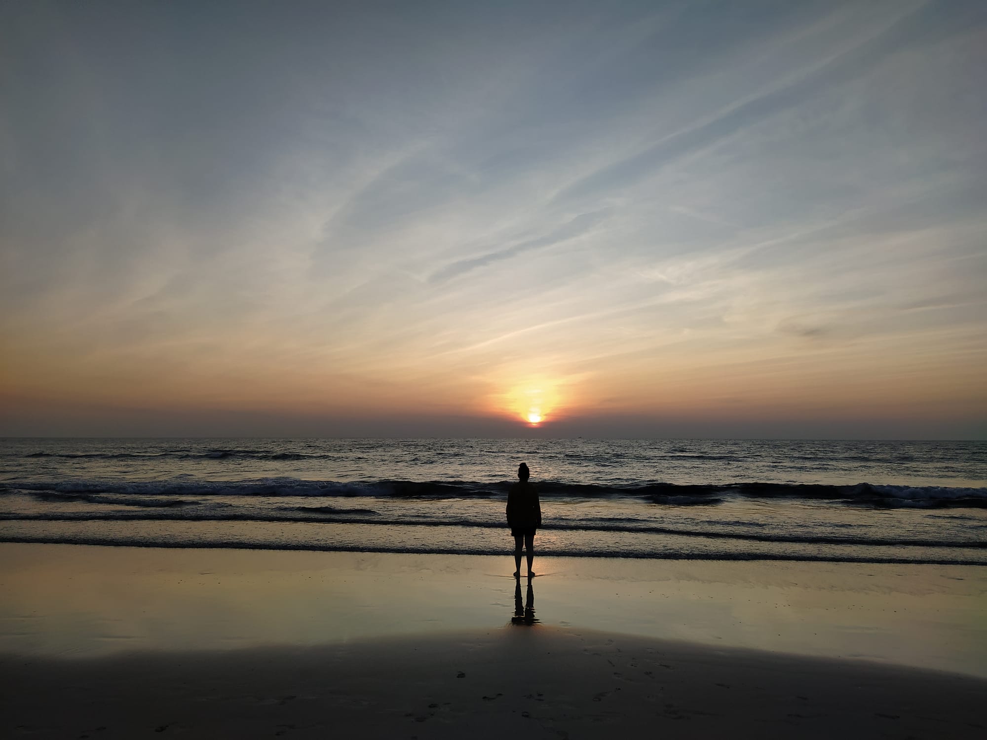 A woman watching the sunset