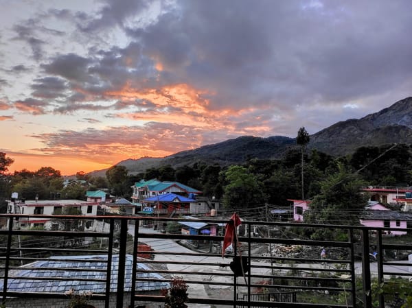 Picture of sunset with mountains in background