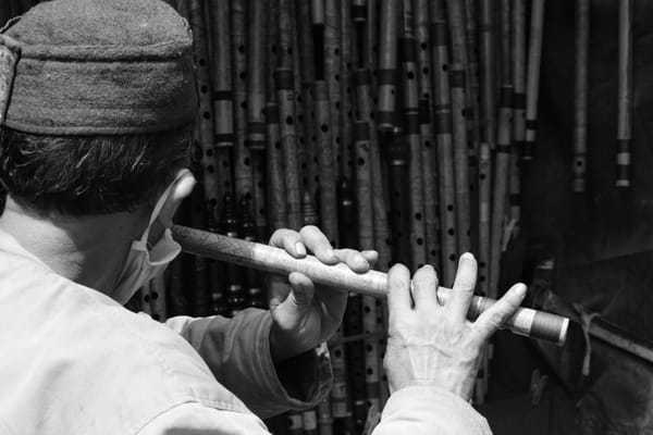 A person singing with a flute