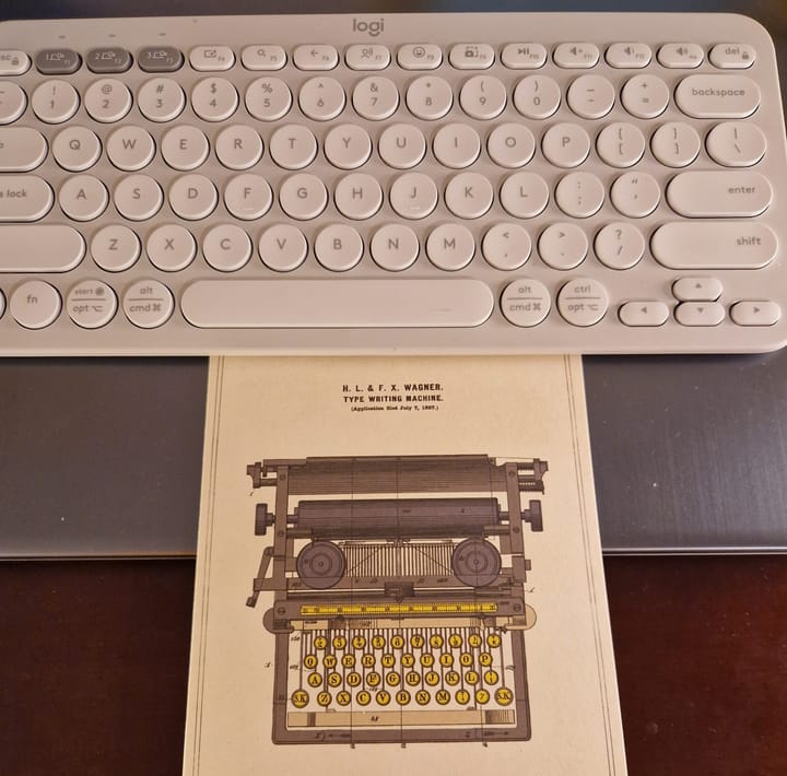 Postcard of a typerwriter and a keyboard