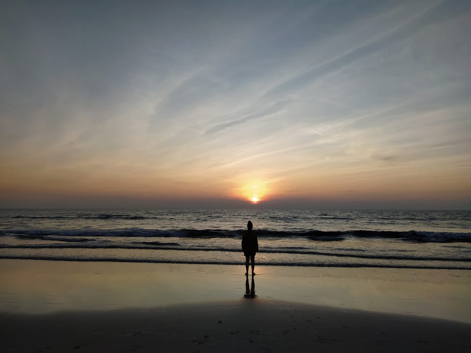 A woman watching the sunset