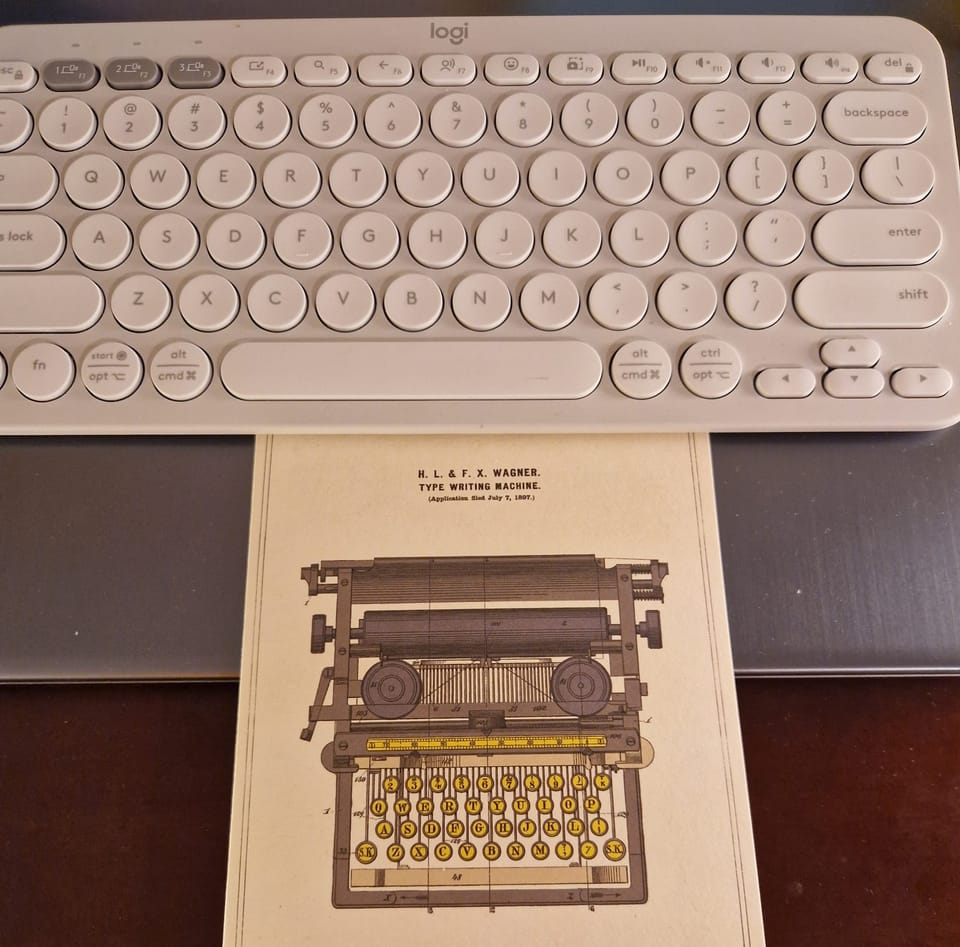 Postcard of a typerwriter and a keyboard
